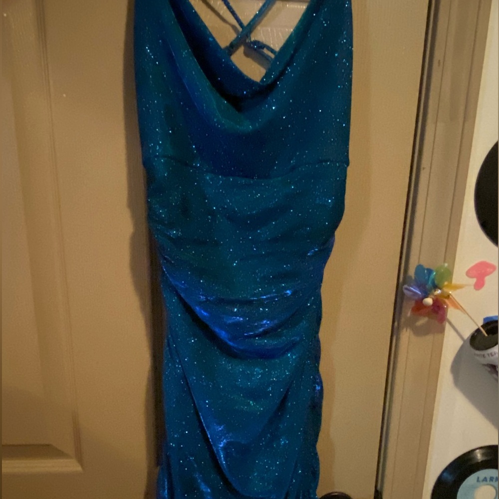 Homecoming dress, tight fit, only worn once, cross over straps in the back.